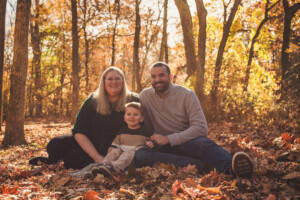 Family playing in the leaves at Tyler State Park
