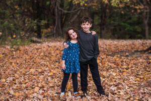 adorable sibling in peak fall color