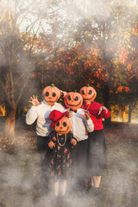 Family portraits with pumpkin heads in Bucks County