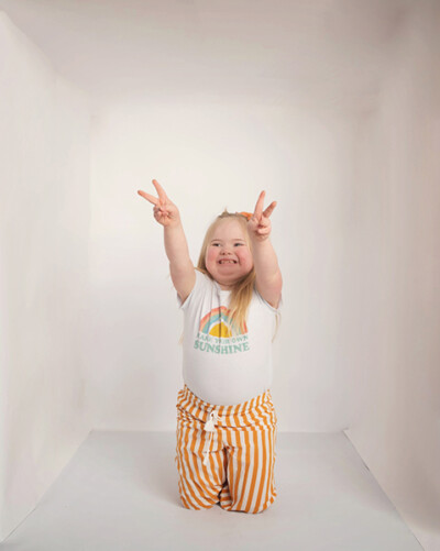 Expressive portrait of girl with Down syndrome being unapologetically herself Bucks County