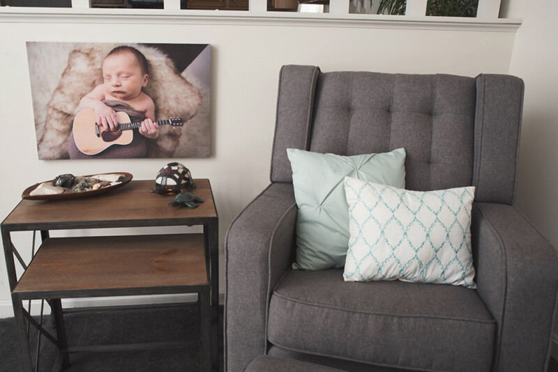 chair with large Premium Canvas Prints of a newborn by Nation's Photo Lab