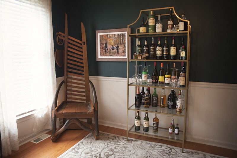 family prints displayed on the wall in the dining room