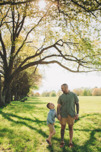 Dad making his kids laugh during an outdoor family portrait session in Bucks County