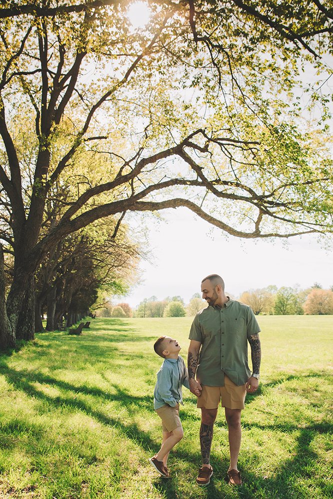 Dad making his kids laugh during an outdoor family portrait session in Bucks County