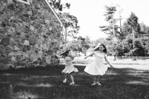 a pair of sisters twirling at Washington Crossing Park