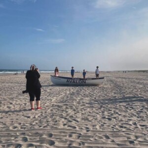a photographer capturing an image on the beach in Avalon, NJ