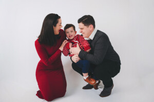 a boy laughing during his holiday portraits in Bucks County, PA