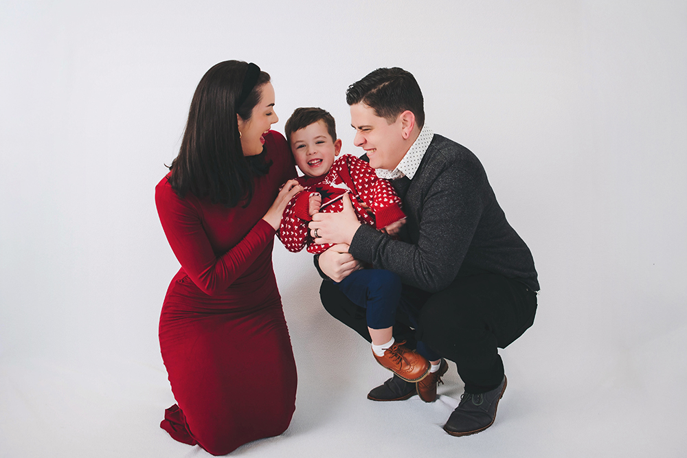 a boy laughing during his holiday portraits in Bucks County, PA