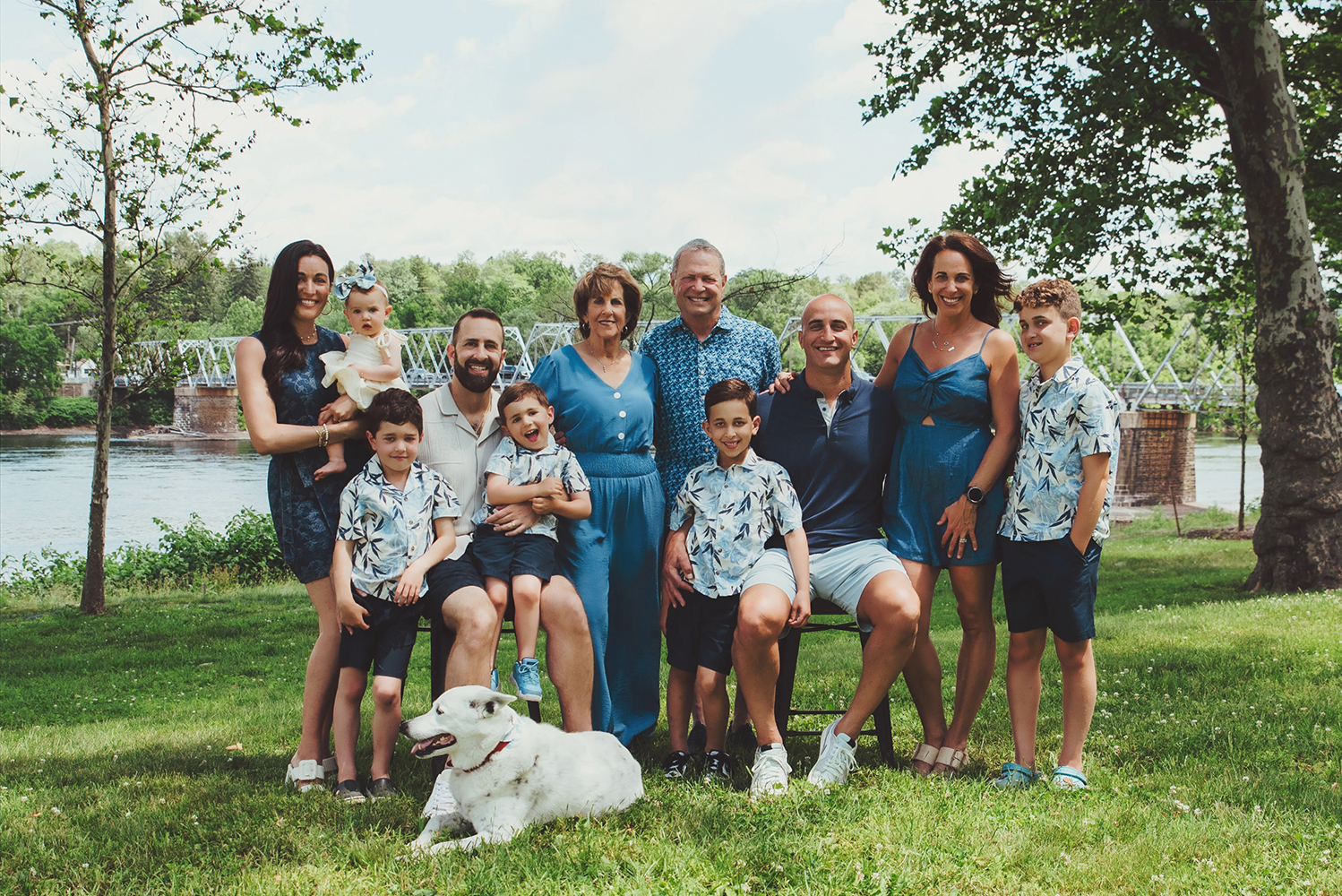 Large family gathered for an outdoor portrait at Washington Crossing Historic Park in Pennsylvania.