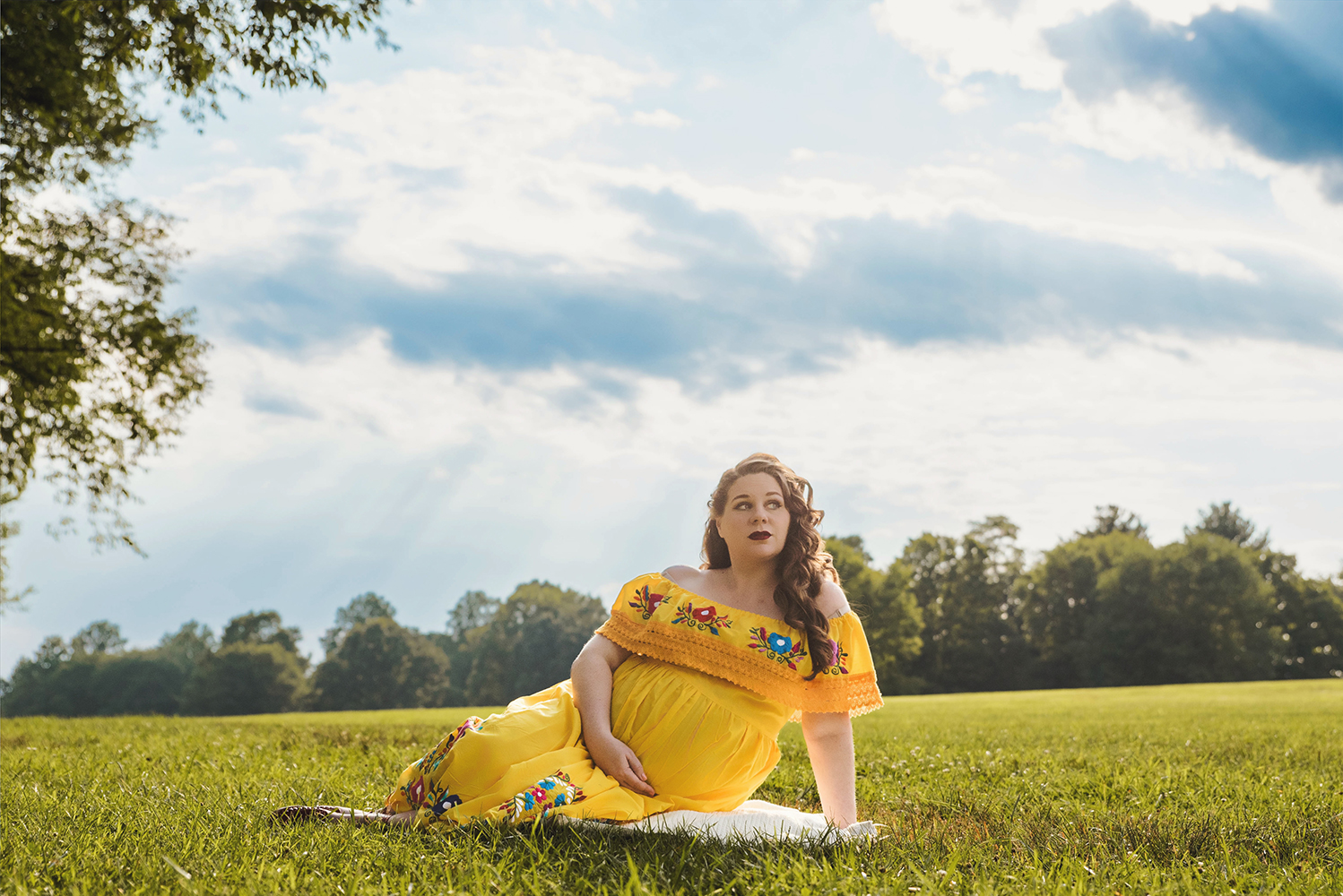 Expectant mother during an outdoor maternity portrait session at Core Creek Park in Bucks County, PA.