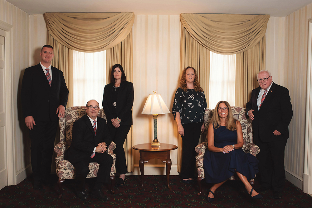 Team portrait at T.J. Fluehr Funeral Home during a professional branding session.
